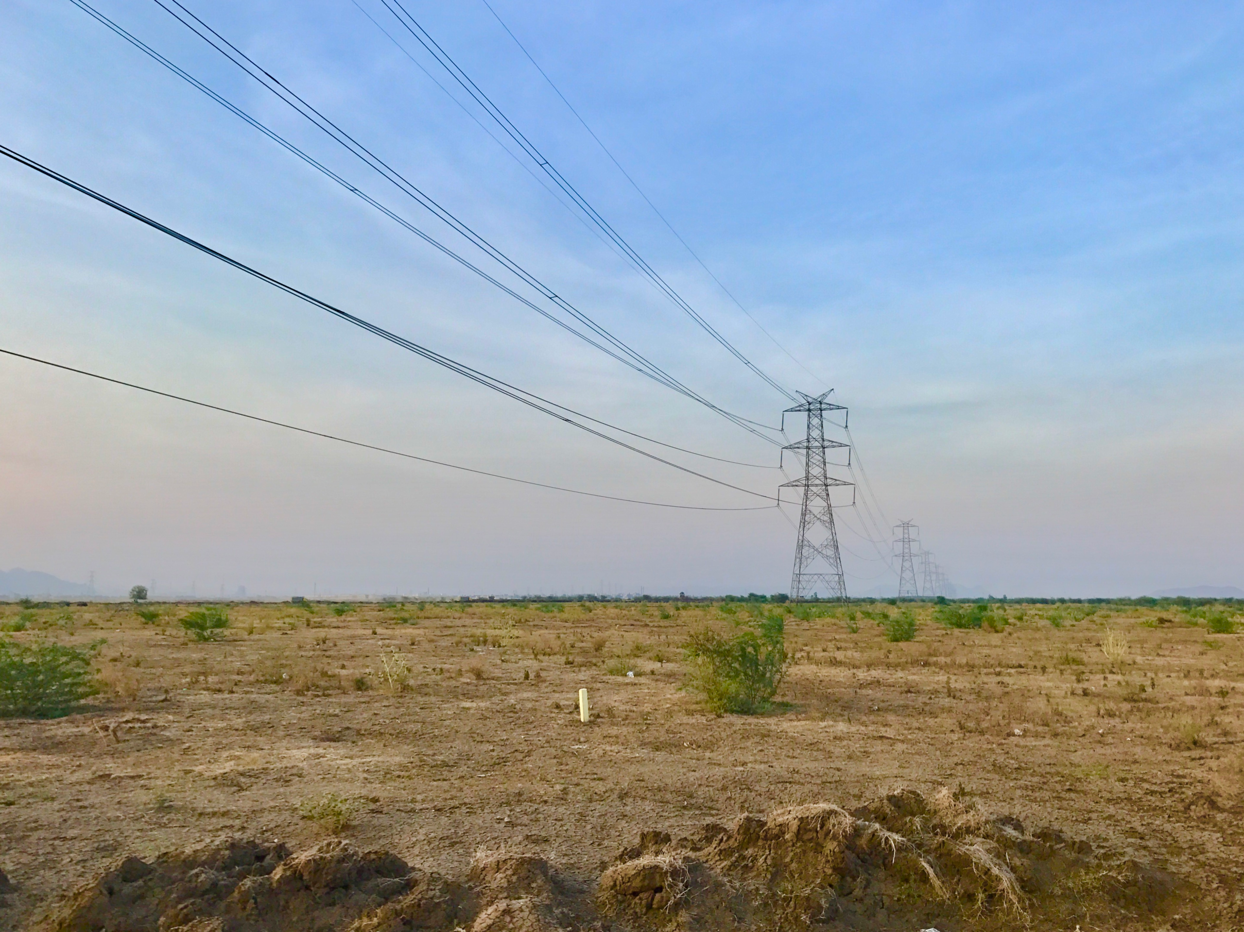 Three-phase overhead transmission lines in Amaravati, India; contextual photograph, not the Gujarat project.